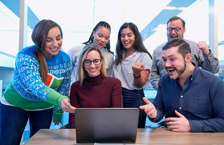 group of students using productivity tools for students on a laptop