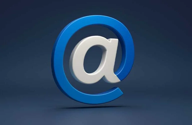 3D @ symbol in blue-to-white, matching modern brand color palette on a dark background