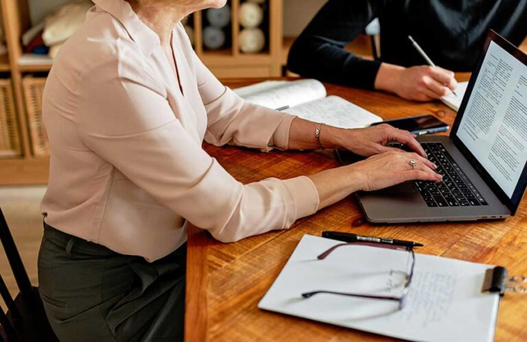 Note-taking software open on laptop used by student and writer